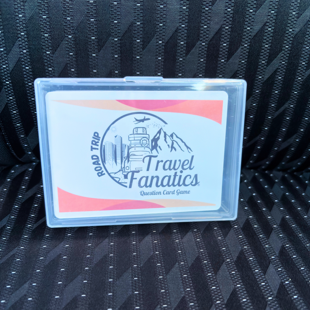 Travel Fanatics question card game packaging on a textured black surface car seat, road trip question Card game packaging with text on a white background for ages 8 and up