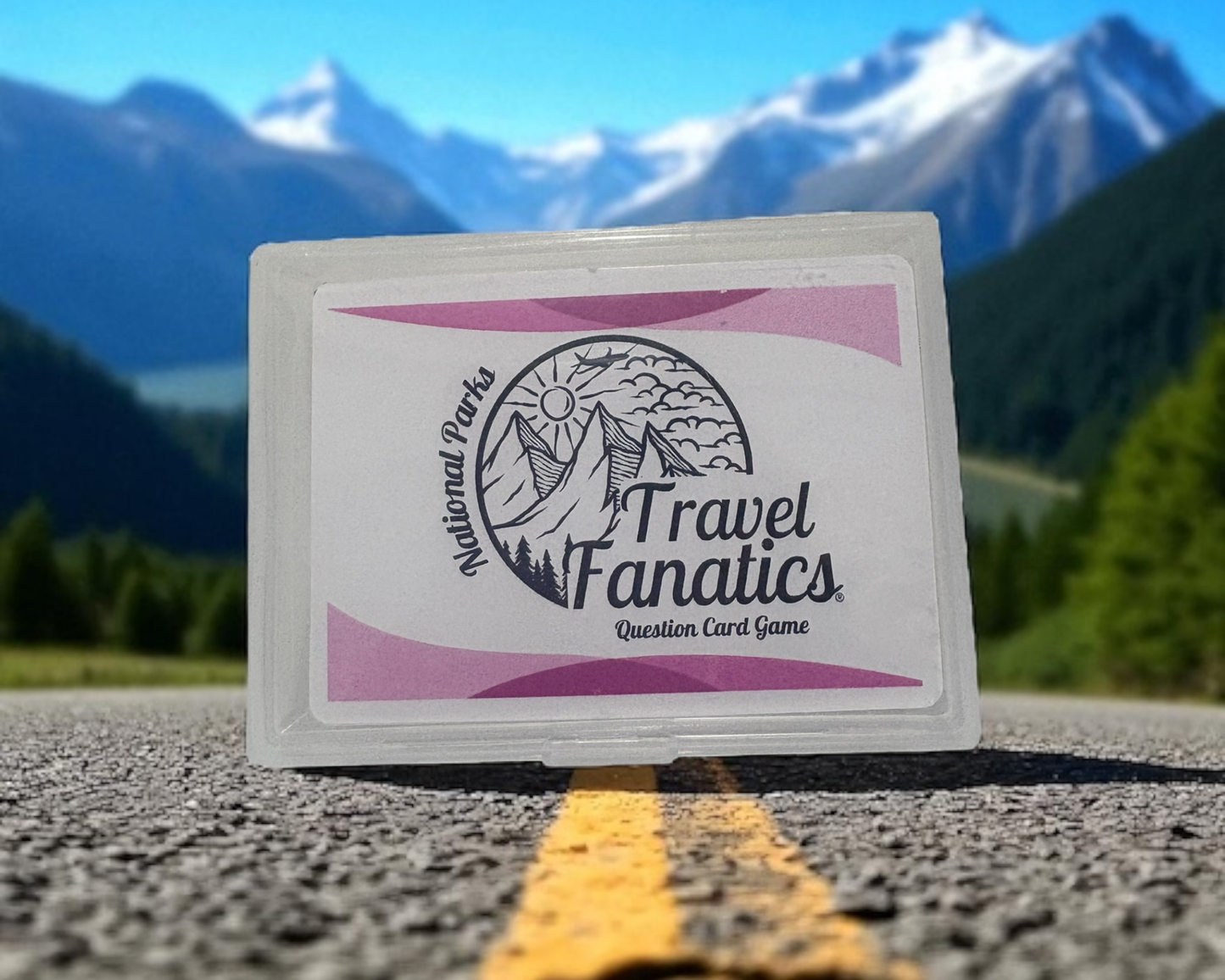 Travel Fanatics question card game box on a road with mountains in the background