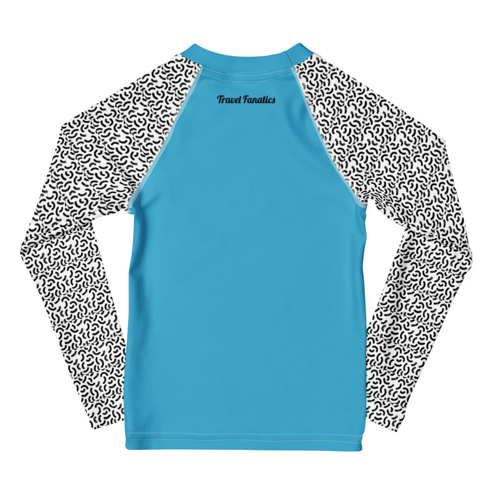 Blue shirt with black and white patterned sleeves on a white background