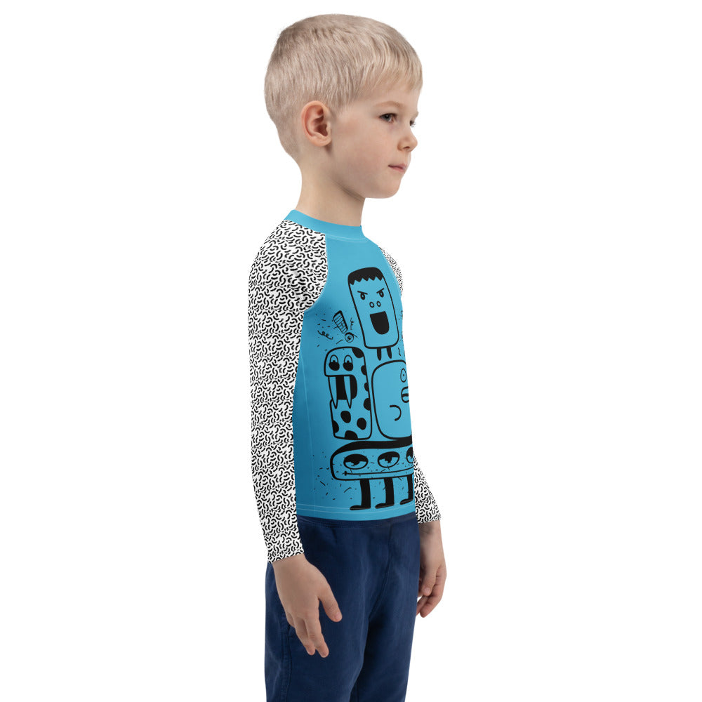 Child wearing a blue and white patterned shirt with robot design on a white background