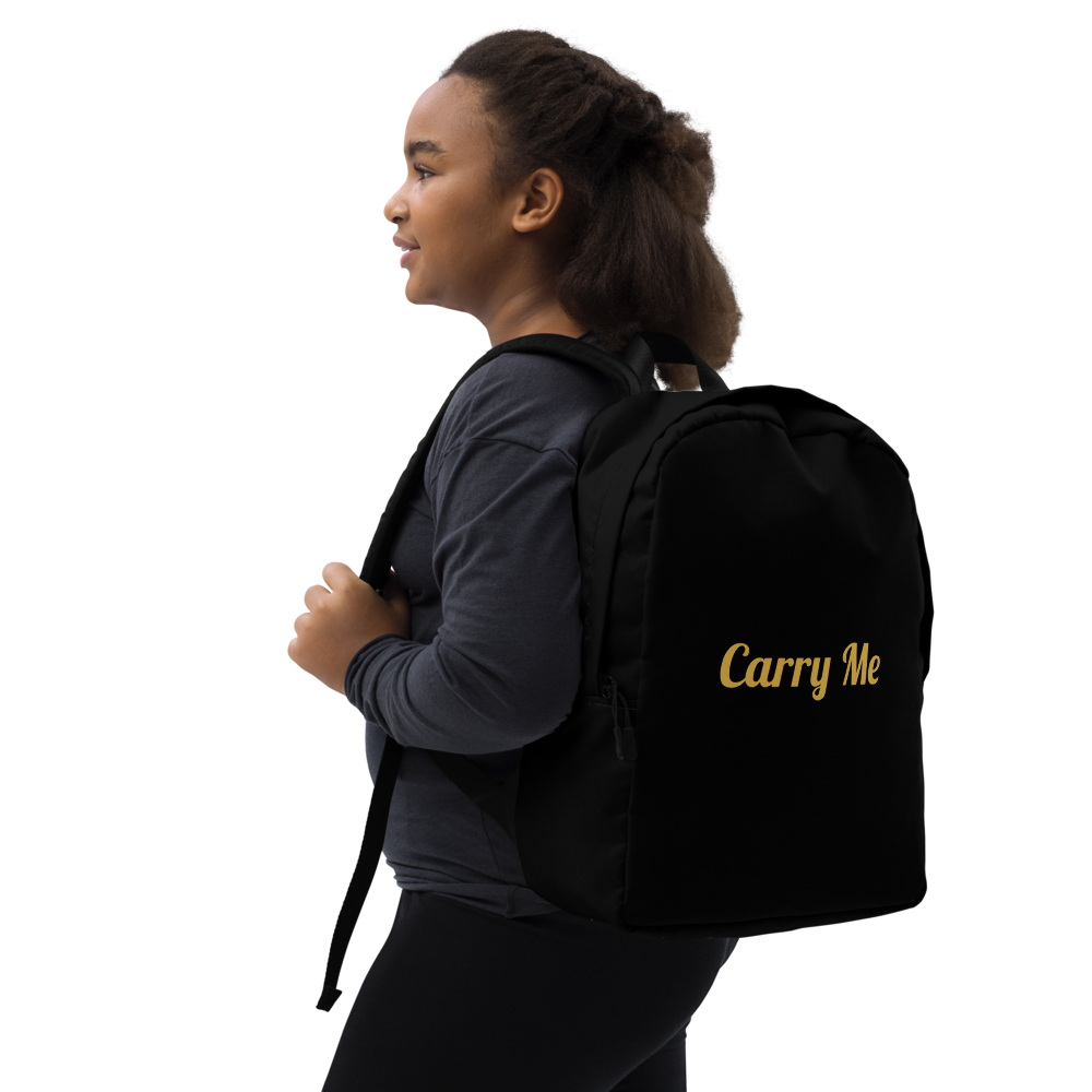 Person wearing a black backpack with 'Carry Me' text on a white background