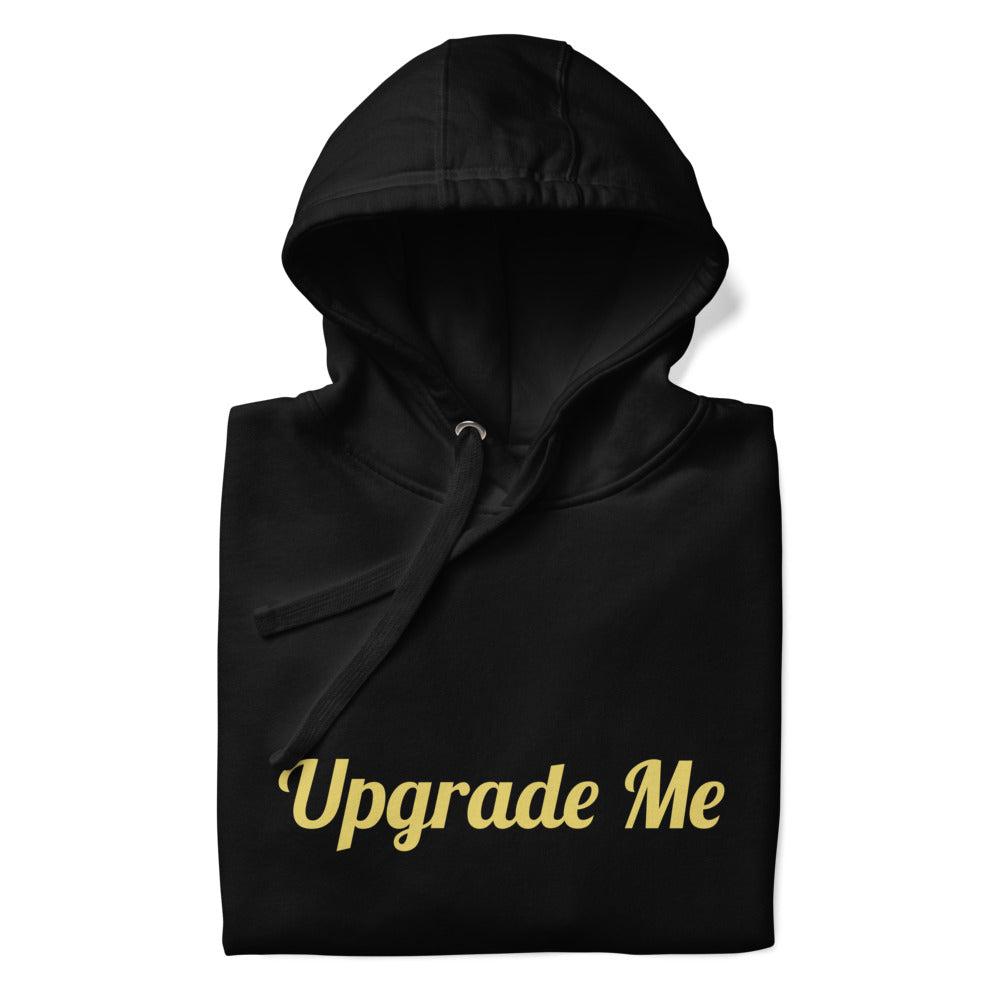 Black hoodie with 'Upgrade Me' text in gold on a white background