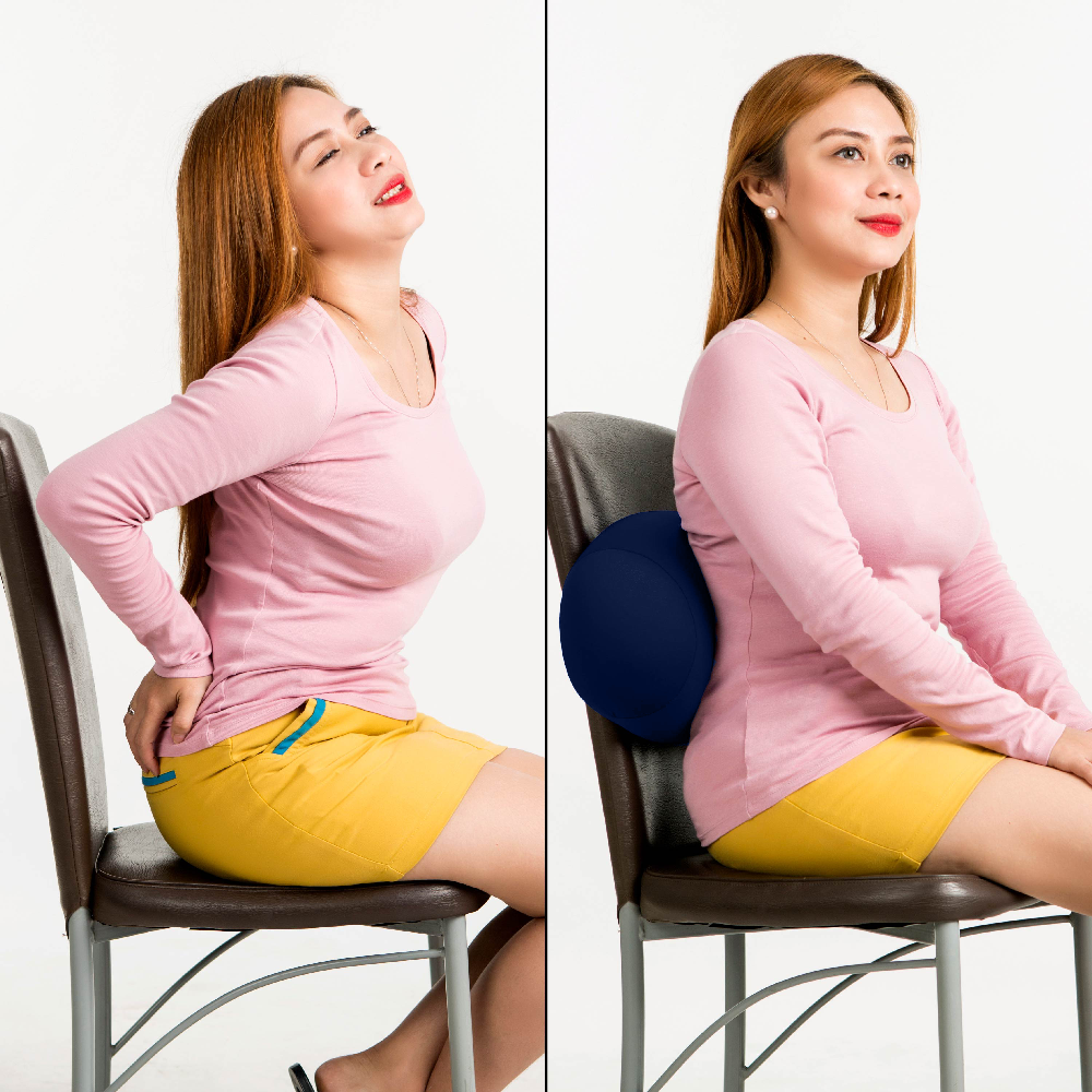 Woman using a blue microbead cushion to support her lower back while sitting on a chair.