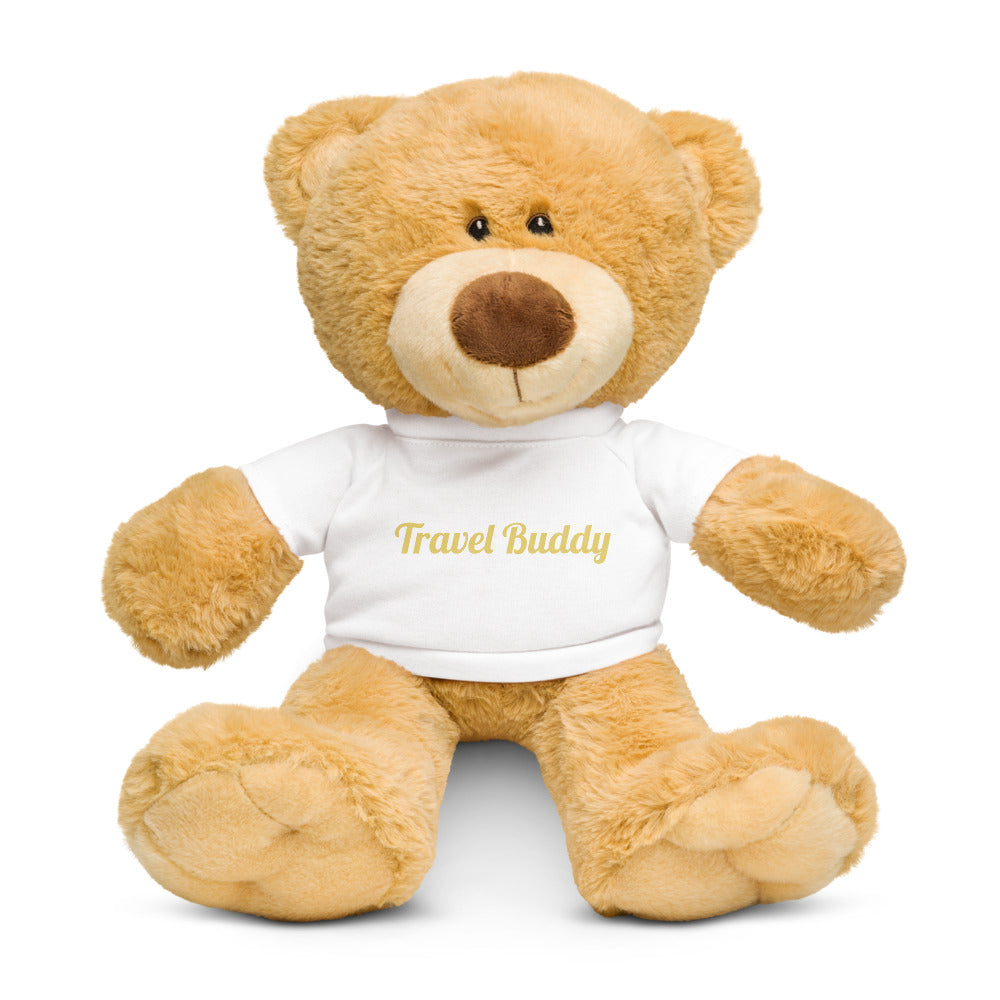 Teddy bear wearing a 'Travel Buddy' shirt on a white background
