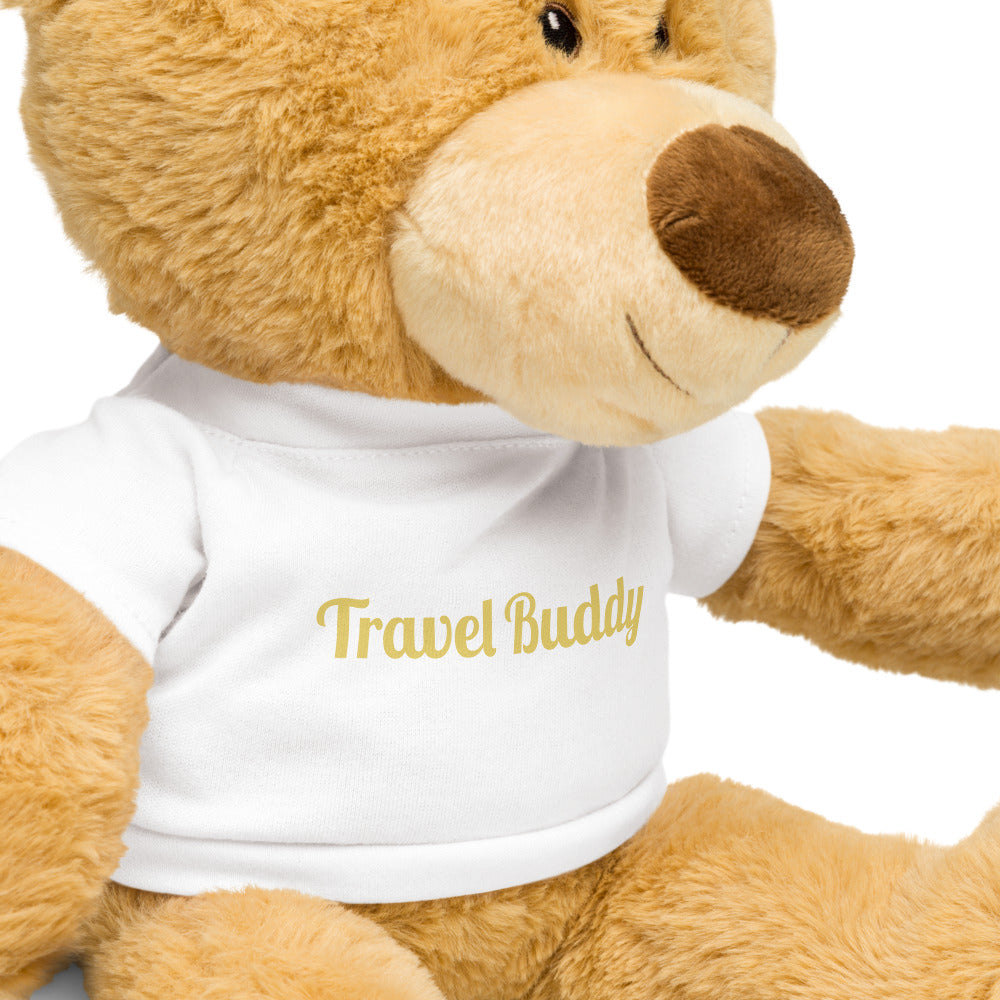 Teddy bear wearing a white t-shirt with 'Travel Buddy' text on a white background