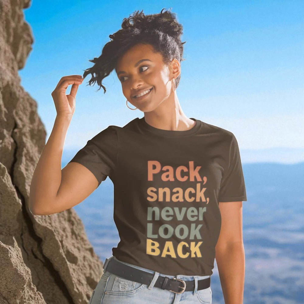 Woman wearing a t-shirt with text in front of a mountainous landscape