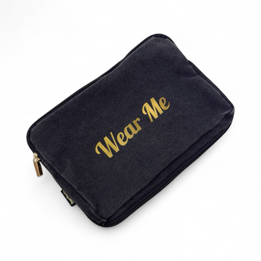 Black pouch with 'Wear Me' text in gold on a white background

