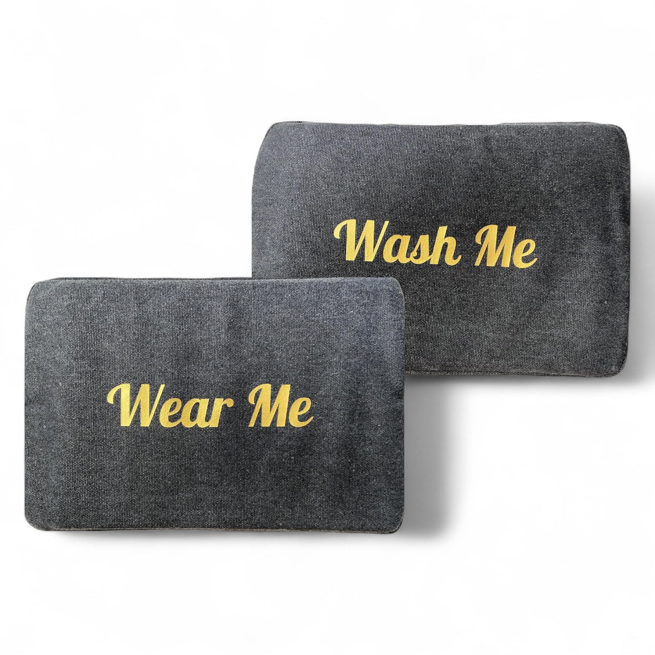Two gray pouches with 'Wash Me' and 'Wear Me' text on a white background

