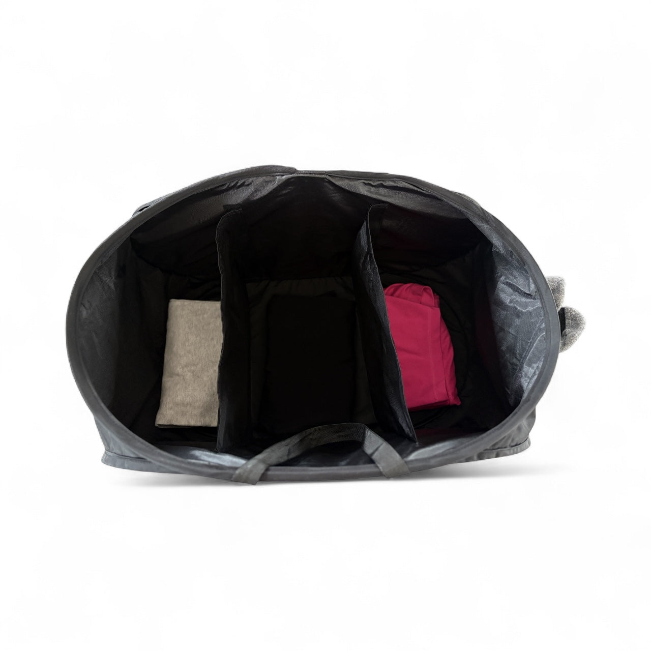 Black pet carrier with interior compartments on a white background

