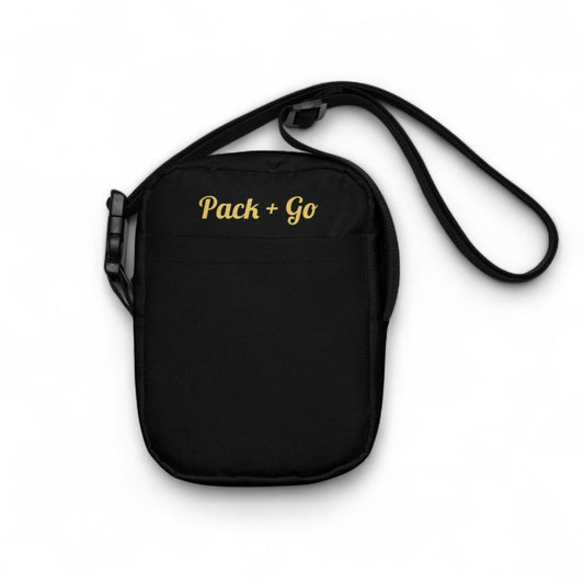Black crossbody bag with 'Pack + Go' text on a white background