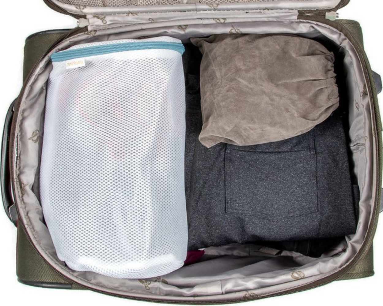 Open suitcase with clothes and a mesh bag inside


