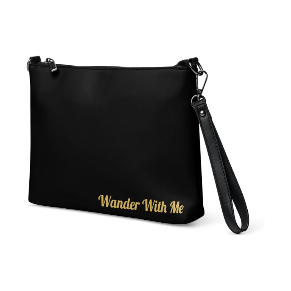 Black pouch with 'Wander With Me' text on a white background

