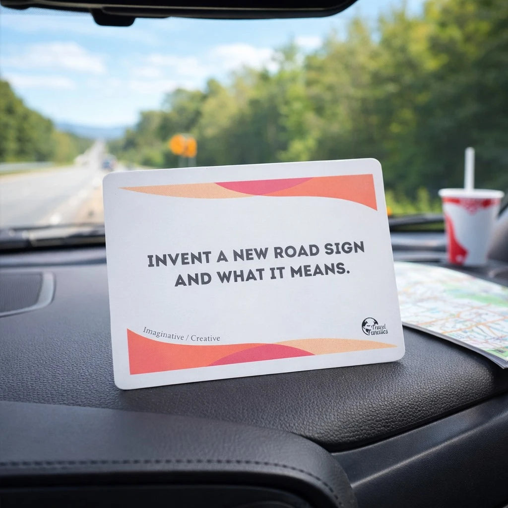 Card on a car dashboard with text 'Invent a new road sign and what it means.'

