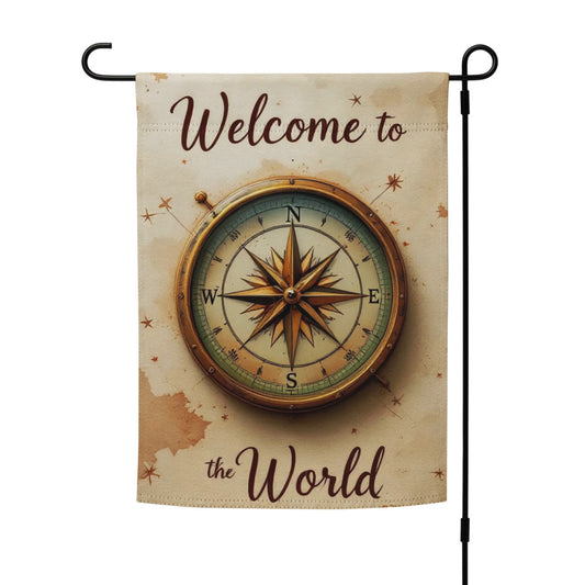 Decorative garden flag with compass design and 'Welcome to the World' text on a beige background.