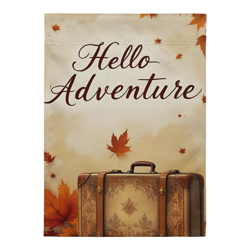 Vintage suitcase with 'Hello Adventure' text and autumn leaves on a beige background

