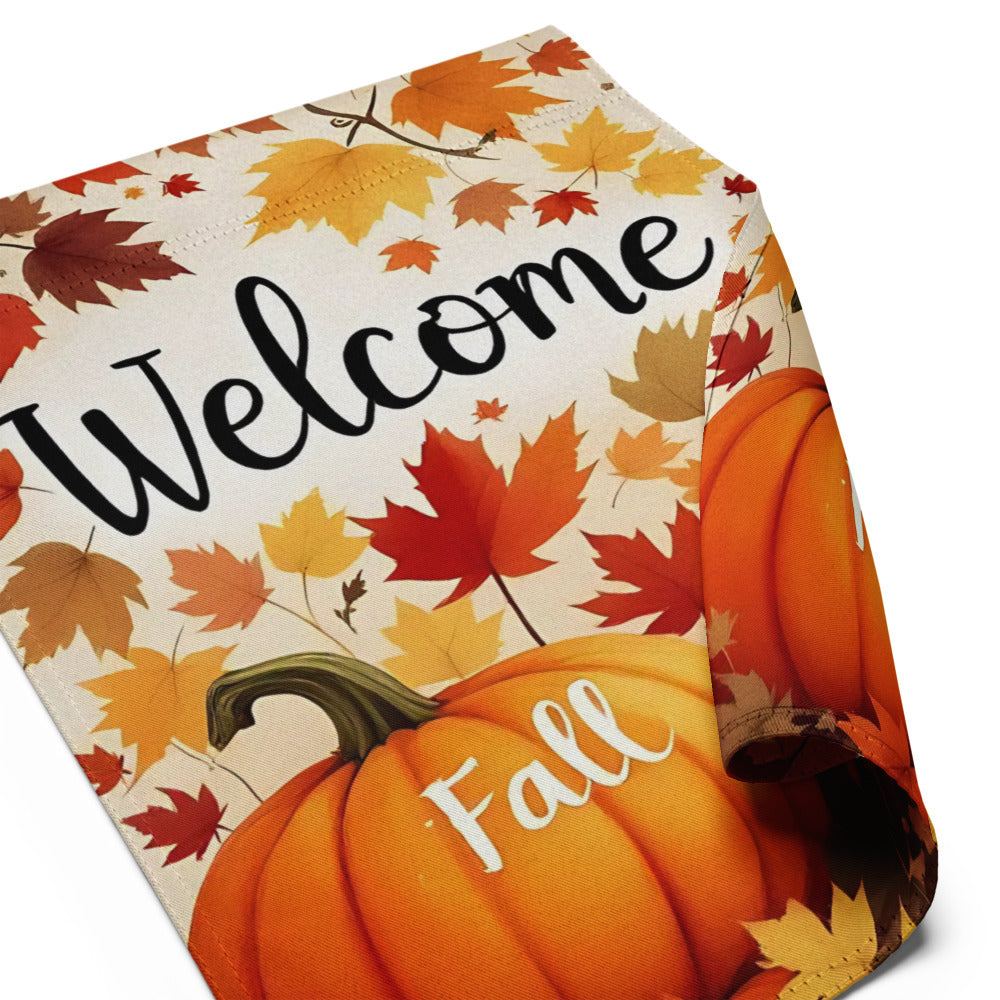 Decorative mat with autumn leaves and pumpkins featuring the words 'Welcome' and 'Fall'.

