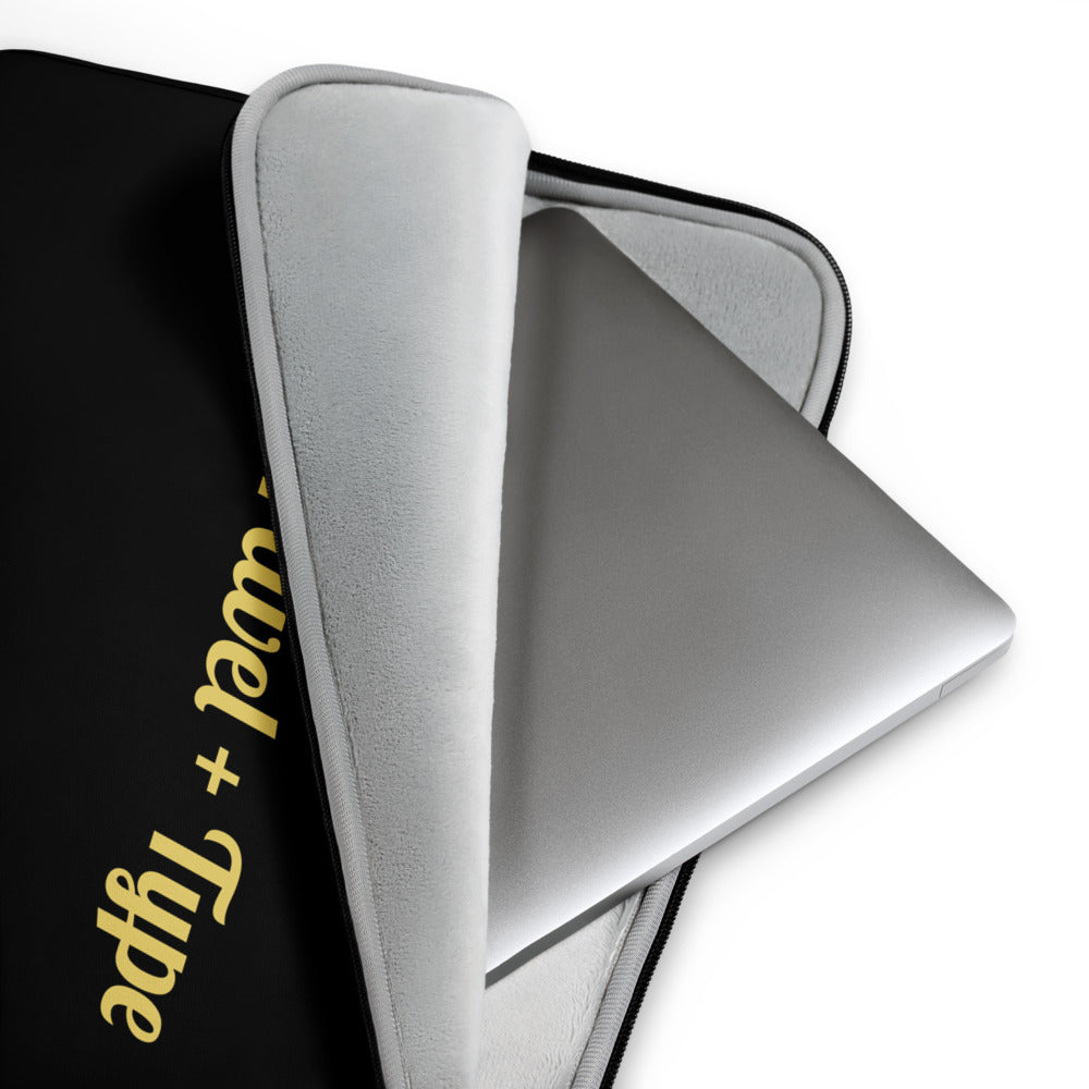 Silver laptop case with 'Wool + Type' branding on a white background

