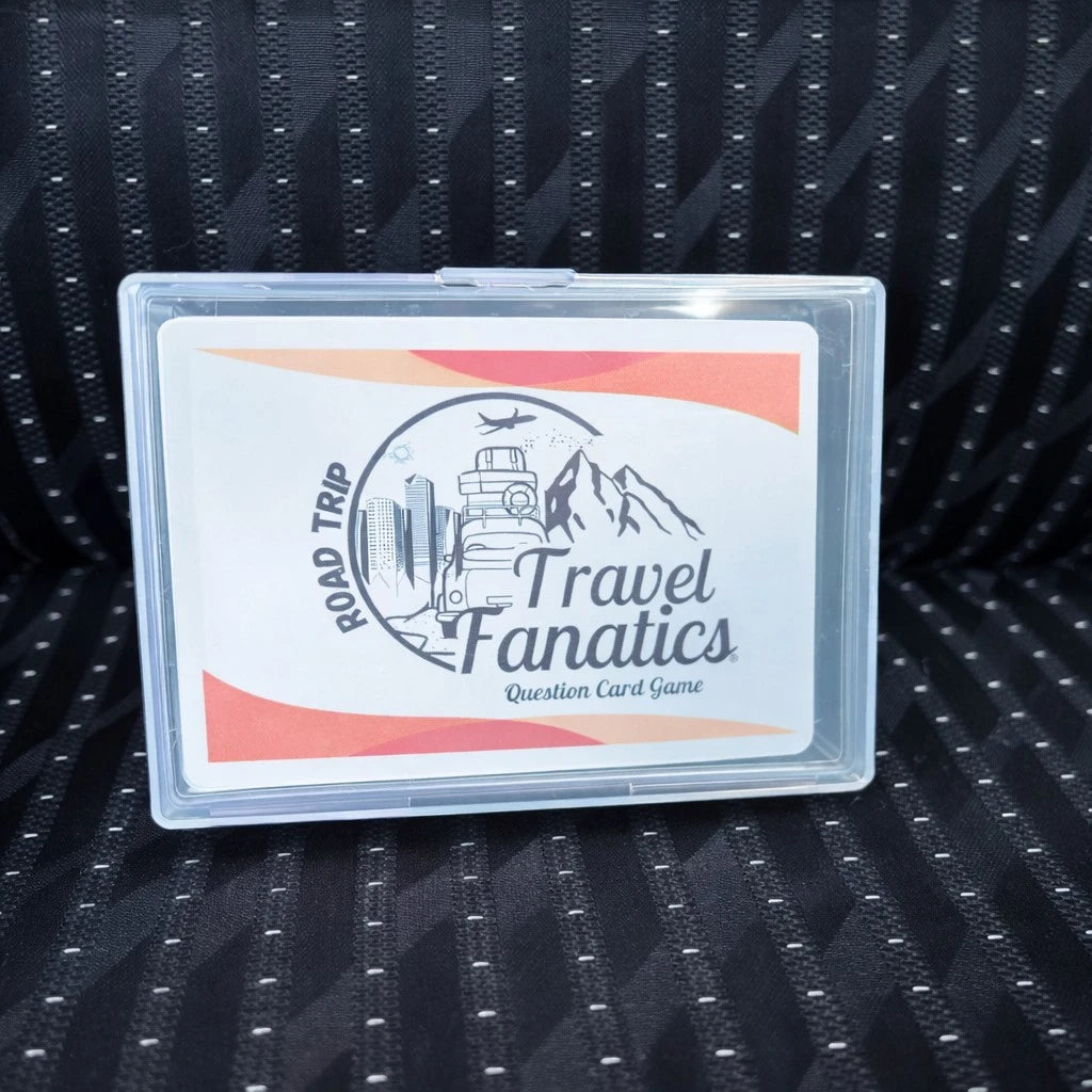Travel Fanatics question card game packaging on a textured black surface

