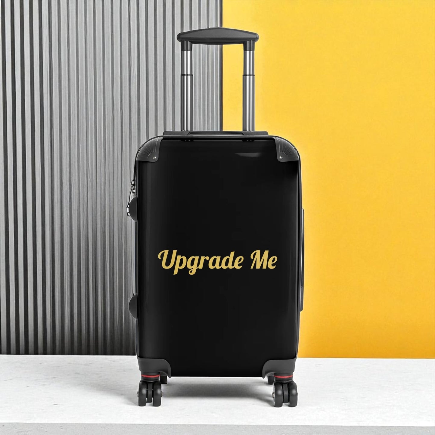 Black suitcase with 'Upgrade Me' text on a yellow and gray background

