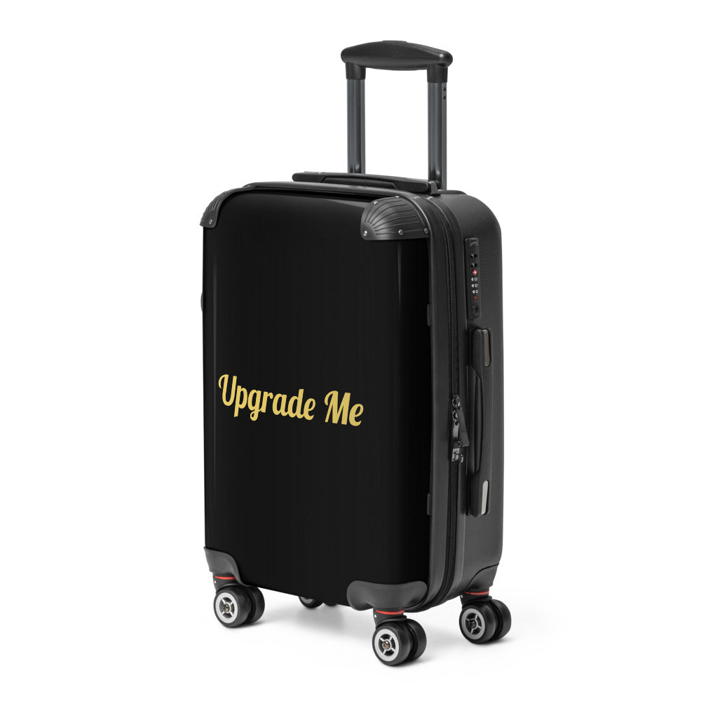 Black suitcase with 'Upgrade Me' text on a white background