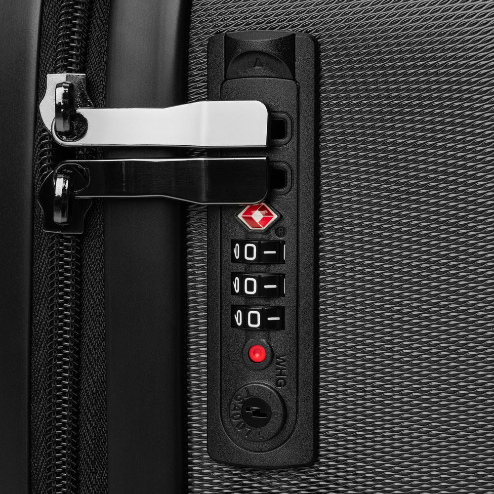 Close-up of a suitcase's combination lock on a textured surface