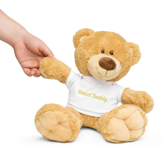 Teddy bear wearing a 'Travel Buddy' shirt with a hand holding its paw on a white background

