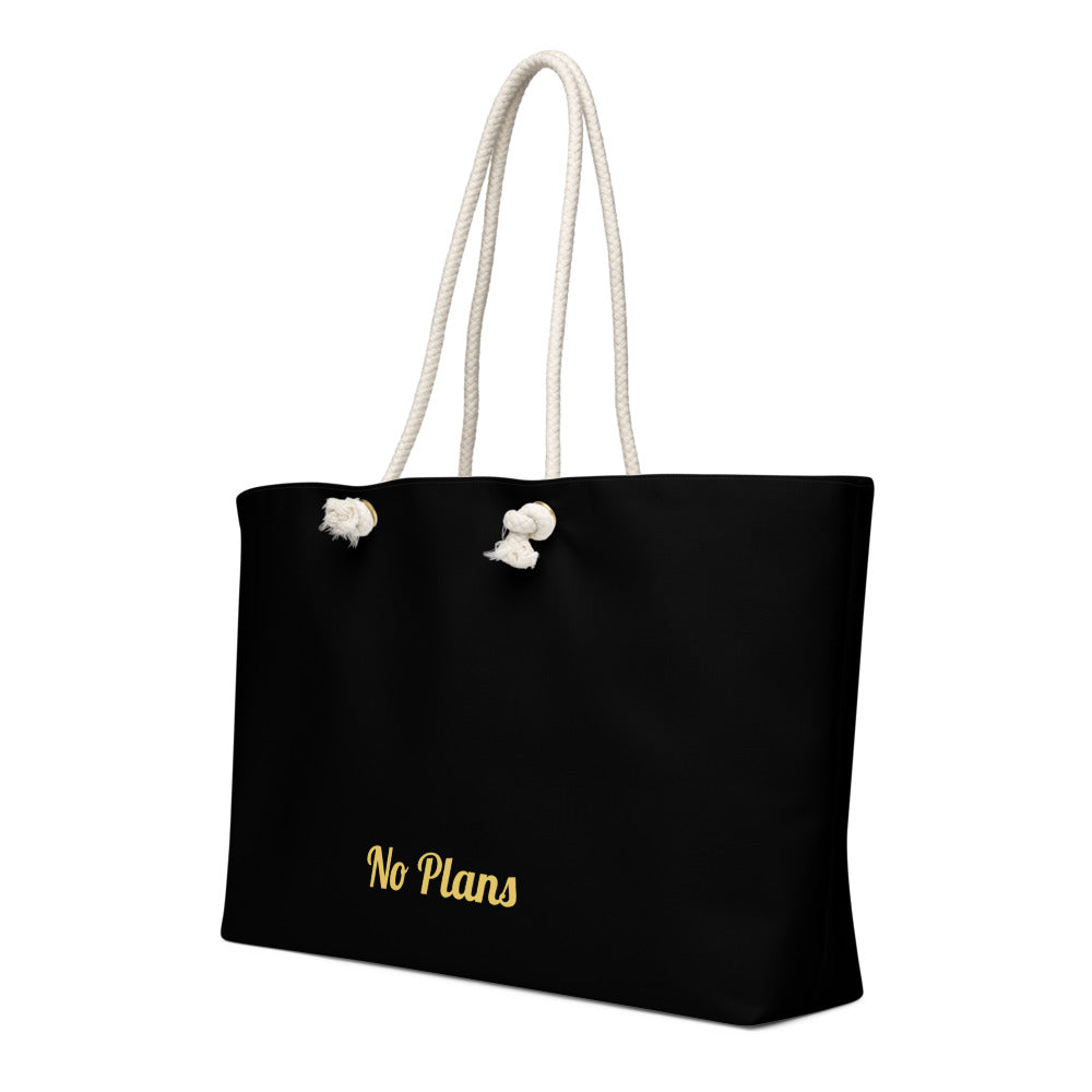 Black tote bag with 'No Plans' text and white rope handles on a white background