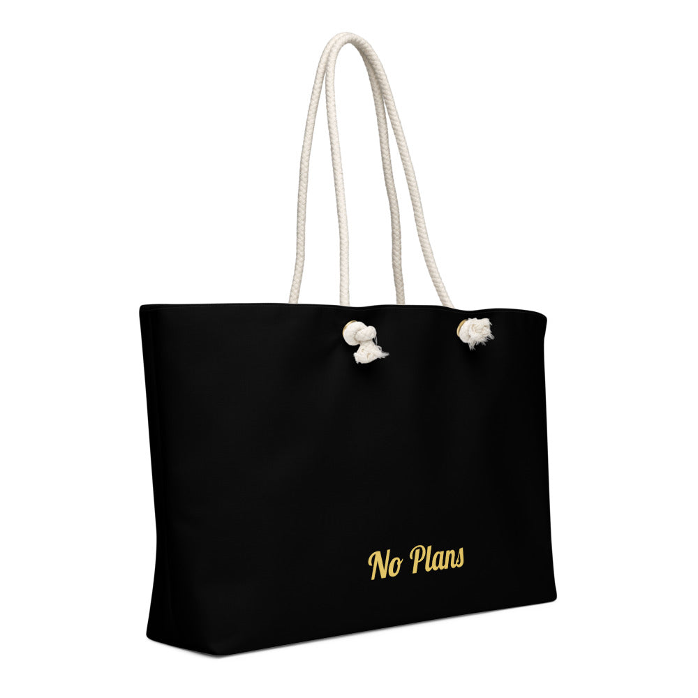 Black tote bag with 'No Plans' text and white handles on a white background

